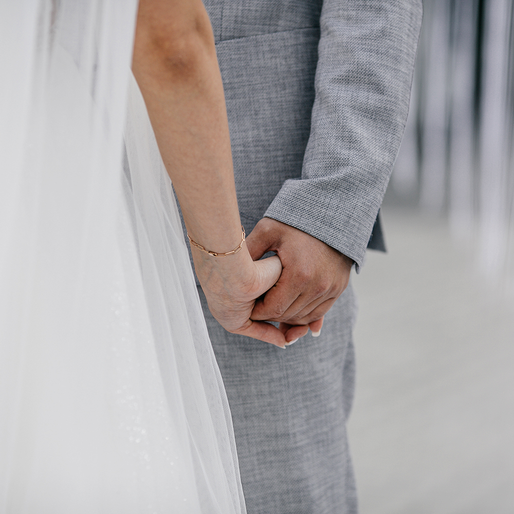 Chou et Tournesol Wedding decor Couple hands love close up